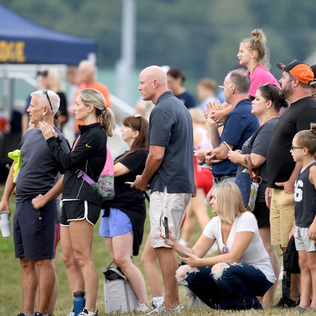 Parents and fans keep eyes and cameras on the course for the youth run in The 2024 Ashley White Invitational at Marlboro High School in August 2024.