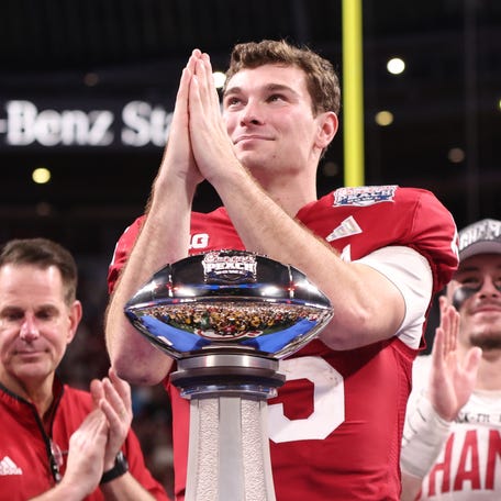 Jan 9, 2026; Atlanta, GA, USA; Indiana Hoosiers quarterback Fernando Mendoza (15) reacts after the 2025 Peach Bowl and semifinal game of the College Football Playoff at Mercedes-Benz Stadium. Mandatory Credit: Brett Davis-Imagn Images