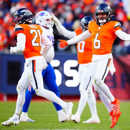 Denver Broncos safety P.J. Locke (6) celebrates with teammates after intercepting a pass during the third quarter of an AFC Divisional Round playoff game against the Buffalo Bills at Empower Field at Mile High in Denver on Jan. 17, 2026.