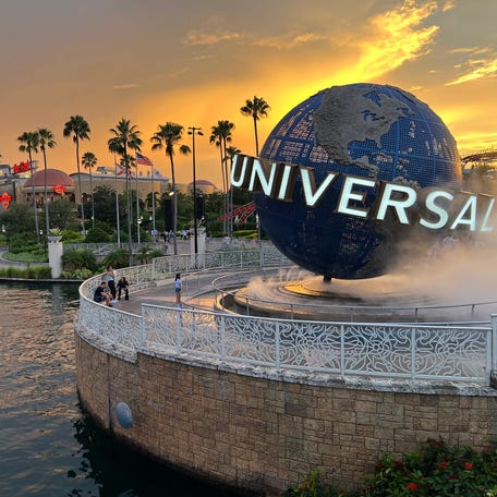 The iconic Universal globe slowly spins at Universal Orlando Resort on July 13, 2024.