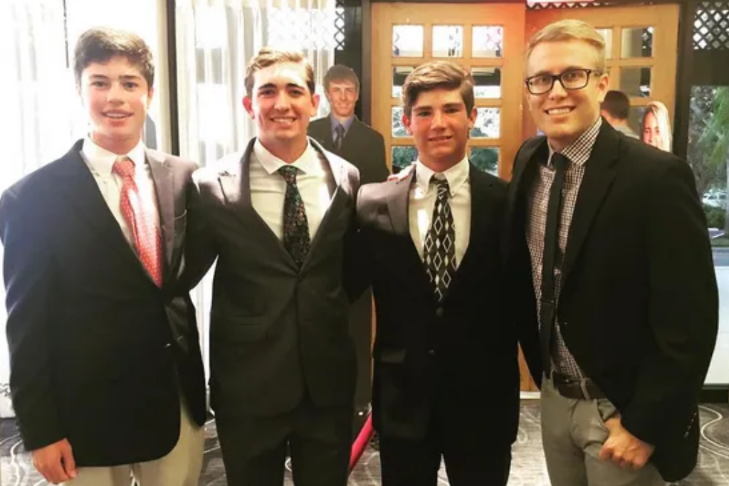 Cole Hammer, Philip Barbaree and Noah Goodwin with Brentley Romine.