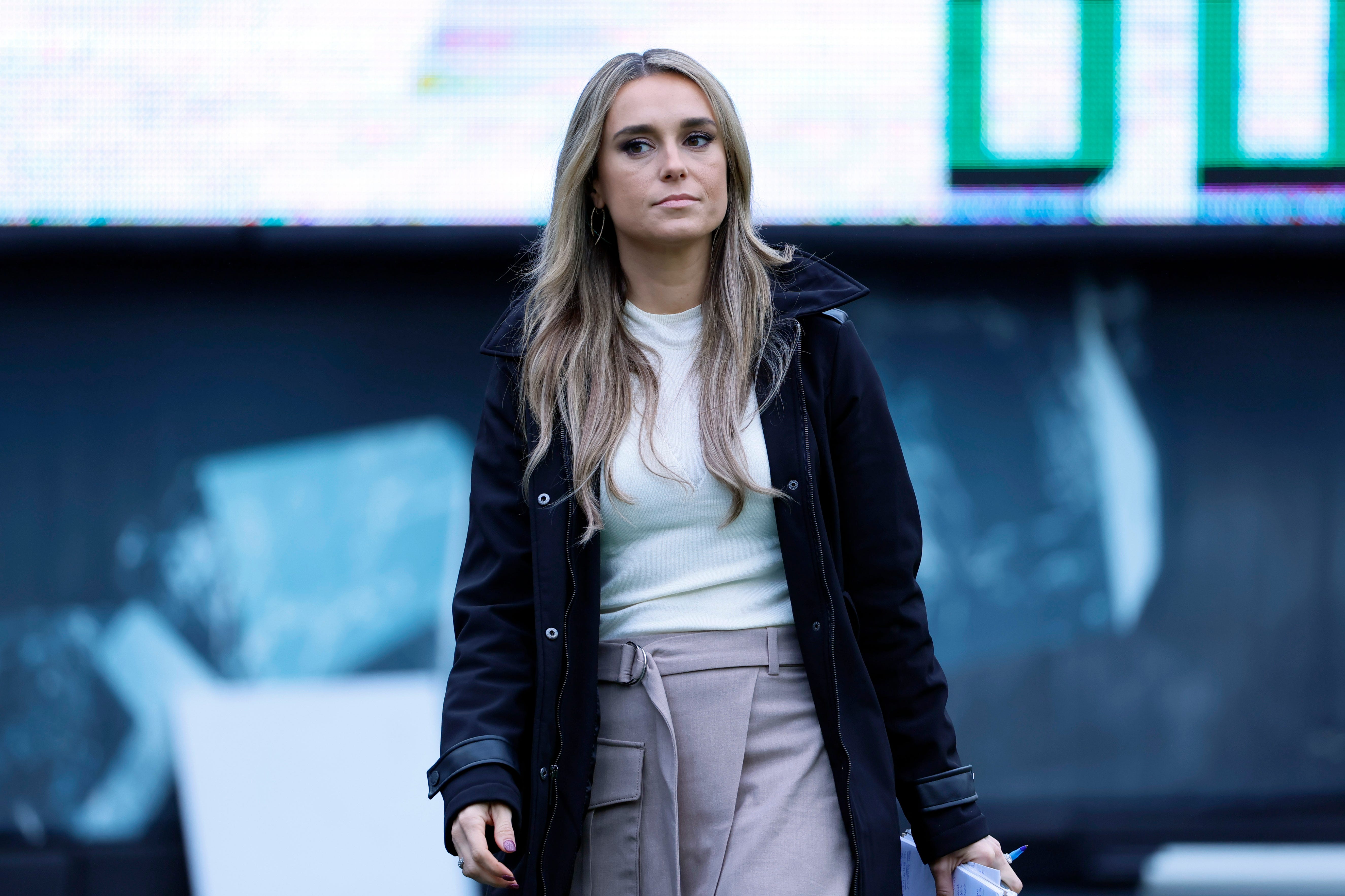 ESPN sideline reporter Molly McGrath walks the field before a game between Oregon Ducks and Washington State Cougars.