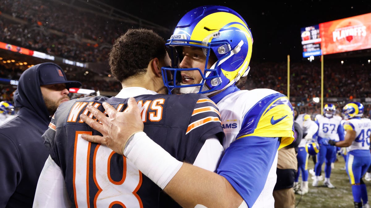 Caleb Williams #18 of the Chicago Bears and Matthew Stafford #9 of the Los Angeles Rams embrace following the NFC Divisional Playoffs game at Soldier Field on January 18, 2026 in Chicago, Illinois.