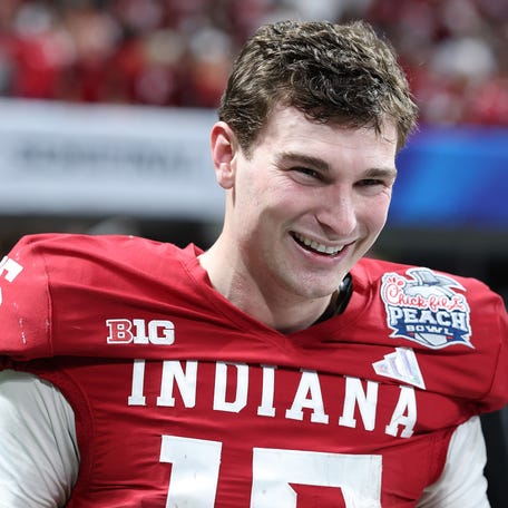 Fernando Mendoza #15 of the Indiana Hoosiers reacts after a touchdown against the Oregon Ducks during the fourth quarter of the 2025 College Football Playoff Semifinal at the Chick-fil-A Peach Bowl at Mercedes-Benz Stadium on January 09, 2026 in Atlanta, Georgia.