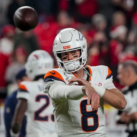 Denver Broncos quarterback Jarrett Stidham (8) warms up before the game at GEHA Field at Arrowhead Stadium.
