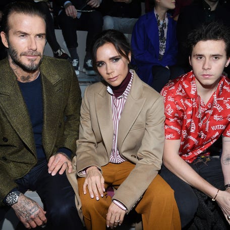 PARIS, FRANCE - JANUARY 18: David Beckham, Victoria Beckham and Brooklyn Beckham attend the Louis Vuitton Menswear Fall/Winter 2018-2019 show as part of Paris Fashion Week on January 18, 2018 in Paris, France. (Photo by Pascal Le Segretain/Getty Images)