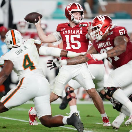 Indiana Hoosiers quarterback Fernando Mendoza (15) passes the ball against the Miami Hurricanes during the first half.