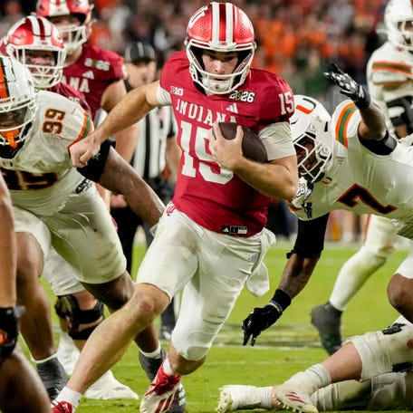 Indiana quarterback Fernando Mendoza (15) rushes into the end zone for a touchdown against Miami during the College Football Playoff national championship game at Hard Rock Stadium in Miami Gardens, Fla., on Jan. 19, 2026.