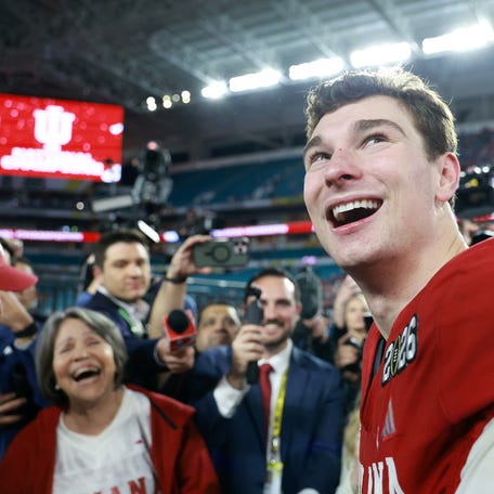 Jan 19, 2026; Miami Gardens, FL, USA; Indiana Hoosiers quarterback Fernando Mendoza (15) races after the College Football Playoff National Championship game against the Miami Hurricanes at Hard Rock Stadium. Mandatory Credit: Mark J. Rebilas-Imagn Images