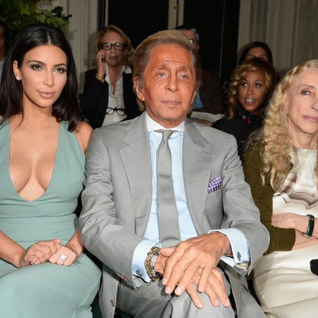 Kim Kardashian, Valentino Garavani and Franca Sozzani attend the Valentino show as part of Paris Fashion Week on July 9, 2014, in Paris, France.