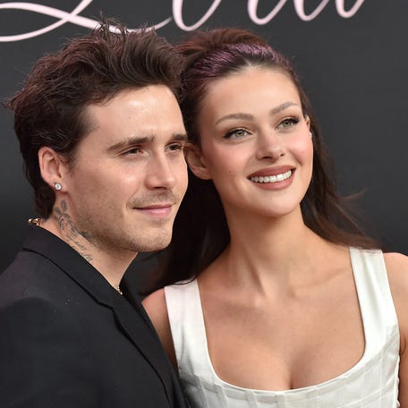 Former British model Brooklyn Beckham (L) and wife US actress Nicola Peltz Beckham arrive for the premiere of the movie "Lola" at the Bruin Theatre, in Los Angeles, California on February 3, 2024. (Photo by LISA O'CONNOR / AFP) (Photo by LISA O'CONNOR/AFP via Getty Images)