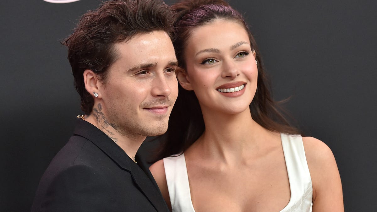 Former British model Brooklyn Beckham (L) and wife US actress Nicola Peltz Beckham arrive for the premiere of the movie "Lola" at the Bruin Theatre, in Los Angeles, California on February 3, 2024. (Photo by LISA O'CONNOR / AFP) (Photo by LISA O'CONNOR/AFP via Getty Images)