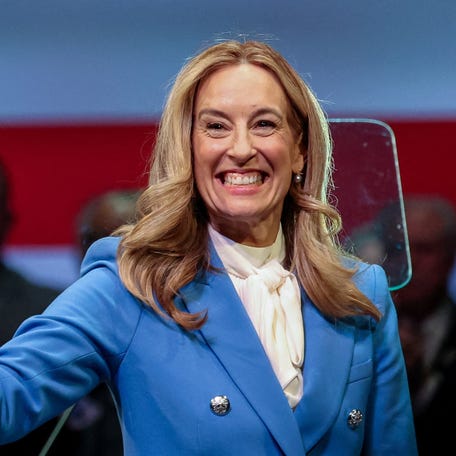 New Jersey Governor Mikie Sherrill waves during her inauguration ceremony.