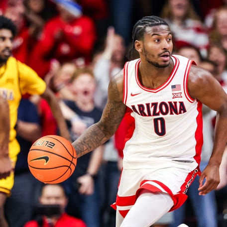 Arizona Wildcats guard Jaden Bradley (0) dribbles the ball during the second half of the game against the Arizona State Sun Devils at McKale Memorial Center.