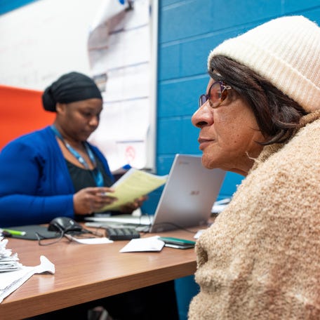 Joanne Sullivan, right, 73, of Detroit, waits for free tax preparation done by seasonal tax preparer Sheila Brooks for the Accounting Aide Society program at The Ford Community Center - East in Detroit on Tuesday, January 20, 2026.