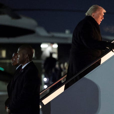 U.S. President Donald Trump boards Air Force One for travel to the World Economic Forum in Davos, Switzerland, from Joint Base Andrews, Maryland, U.S., January 20, 2026. REUTERS/Jonathan Ernst