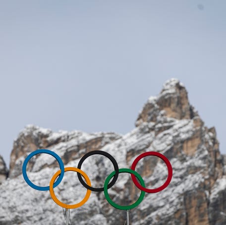 The Olympic rings are set in front of surrounding mountains on Nov. 22, 2025, in Cortina d'Ampezzo, Italy. The Winter Olympics will begin Feb. 6, 2026, and end Feb. 22.