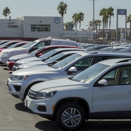 New and used Volkswagen vehicles are shown for sale at a Volkswagen car dealership in San Diego, California.