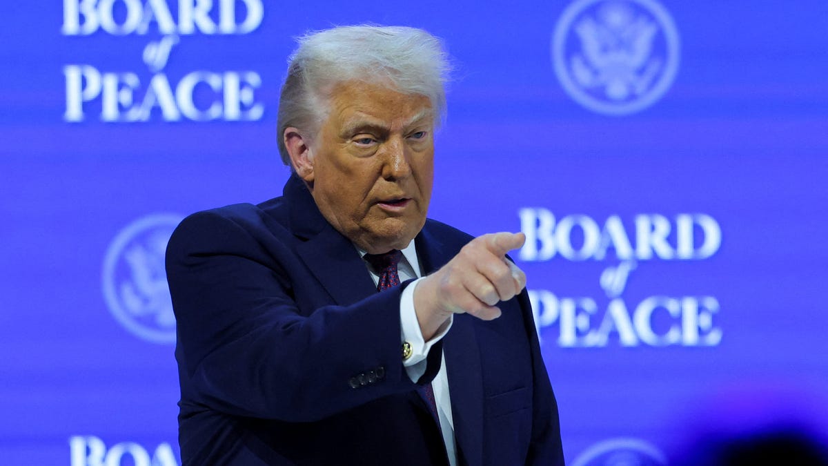 President Donald Trump takes part in a charter announcement for his Board of Peace initiative aimed at resolving global conflicts, alongside the 56th annual World Economic Forum (WEF), in Davos, Switzerland, January 22, 2026.