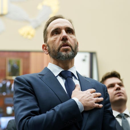 Former special counsel Jack Smith says the Pledge of Allegiance before testifying on Capitol Hill on Jan. 22, 2026, in Washington, DC.