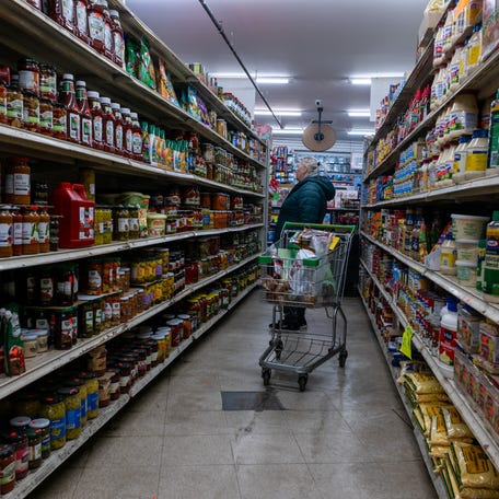 People shop at a grocery store in Brooklyn on December 12, 2025 in New York City.