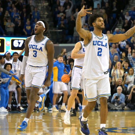 UCLA Bruins guard Eric Dailey Jr. (3) and and guard Donovan Dent (2) celebrate after defeating the Purdue Boilermakers at Pauley Pavilion presented by Wescom Financial.