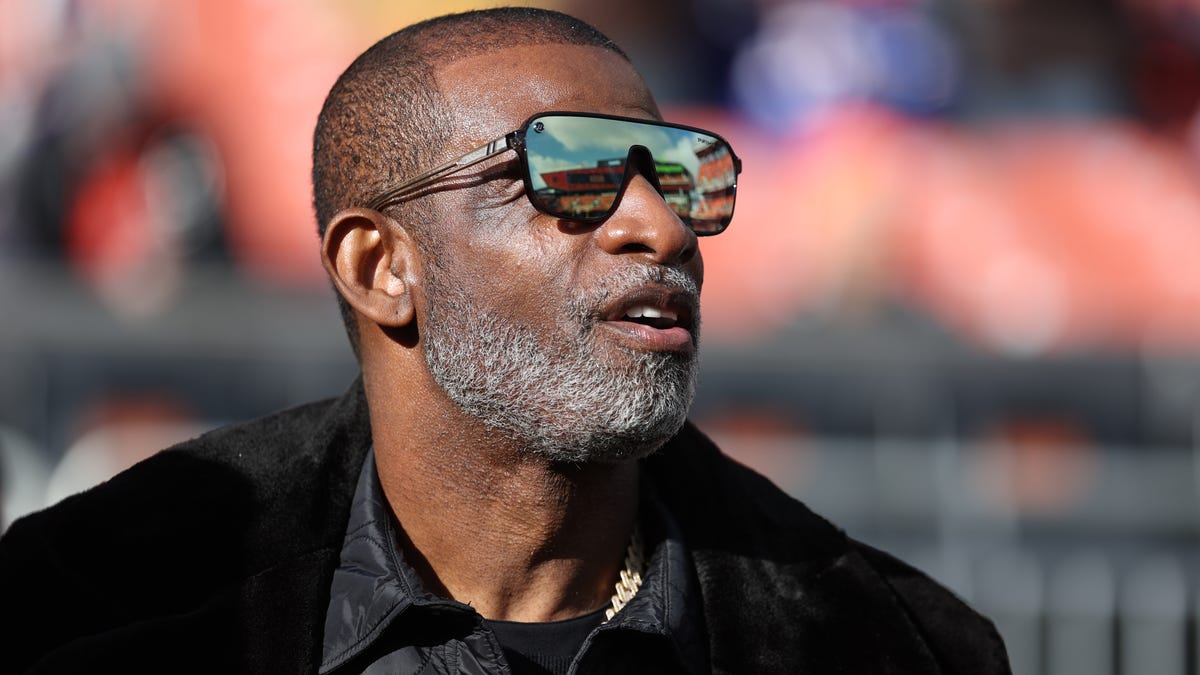 Deion Sanders watches a Cleveland Browns game in December.