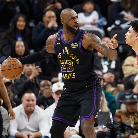 LeBron James controls the ball against Kobe Sanders in the first half at Intuit Dome.