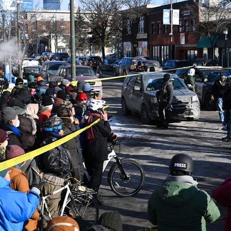 People gather at the scene of a shooting involving federal agents, in Minneapolis, Minnesota, January 24, 2026.