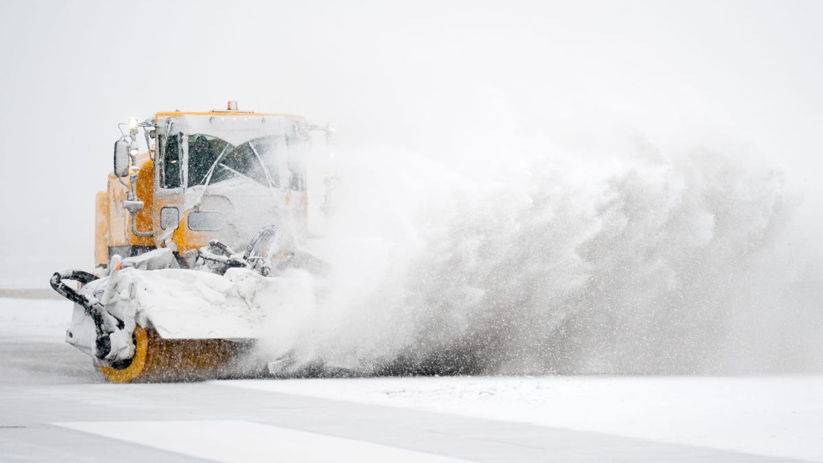 Snow plows clear a runway at Nashville International Airport in Nashville, Tenn., Saturday, Jan. 24, 2026. A winter storm brought snow and ice to Middle Tennessee on Saturday.