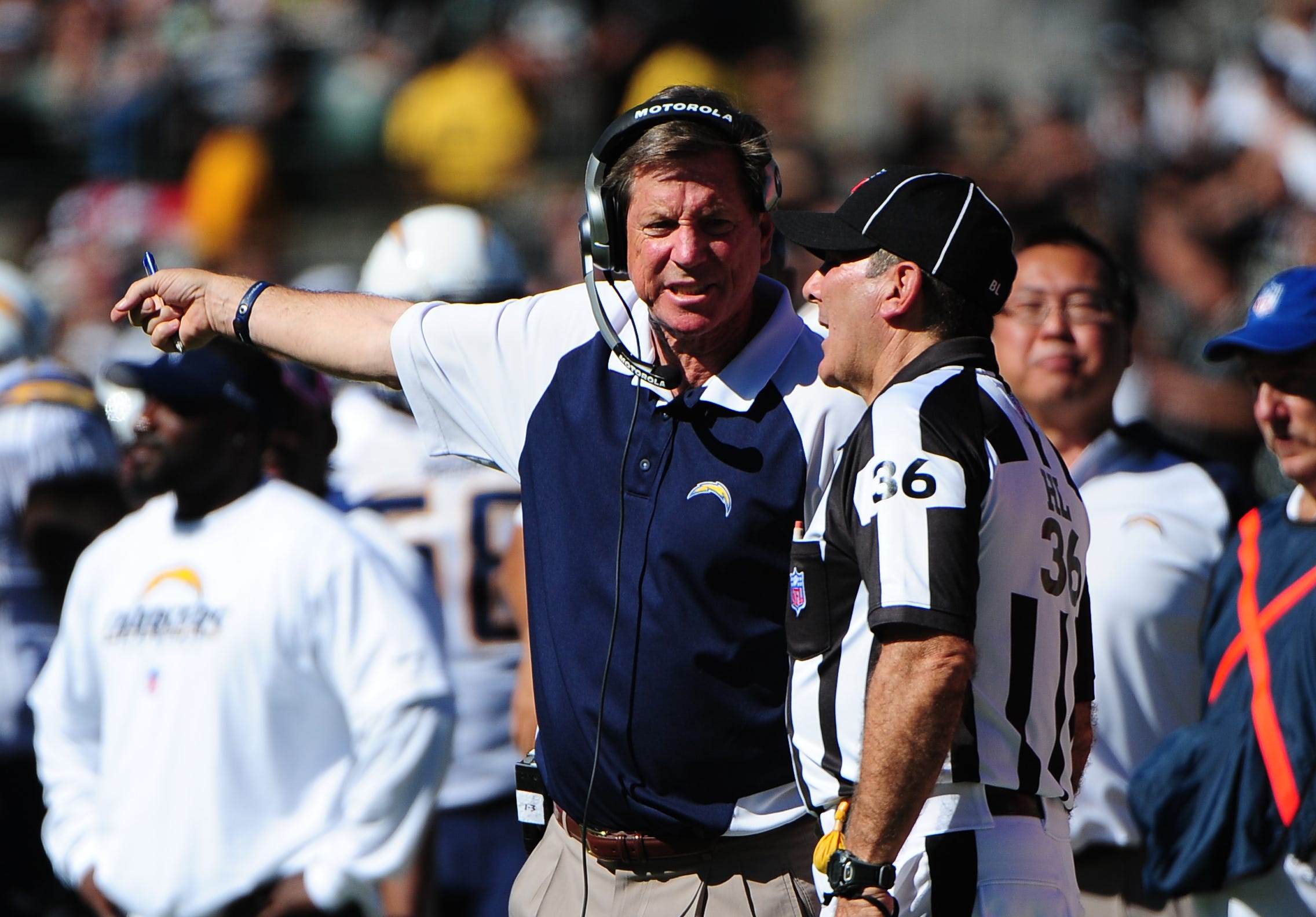 San Diego Chargers head coach Norv Turner (left) argues a call with head linesman Tony Veteri (36).