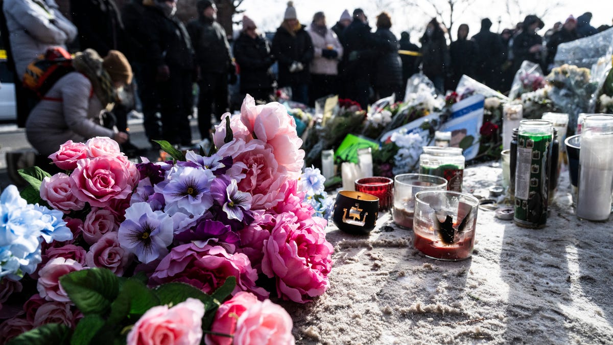 On Jan. 25, mourners gather at a makeshift memorial in the area where 37-year-old ICU nurse Alex Pretti was shot dead a day earlier by federal immigration agents in Minneapolis, Minn.