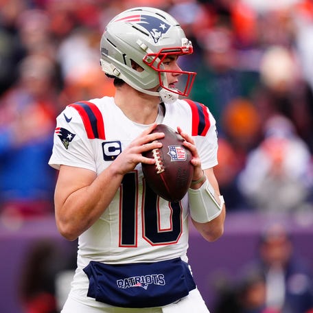 New England Patriots quarterback Drake Maye (10) drops back to pass against the Denver Broncos during the first half in the 2026 AFC Championship Game at Empower Field at Mile High.