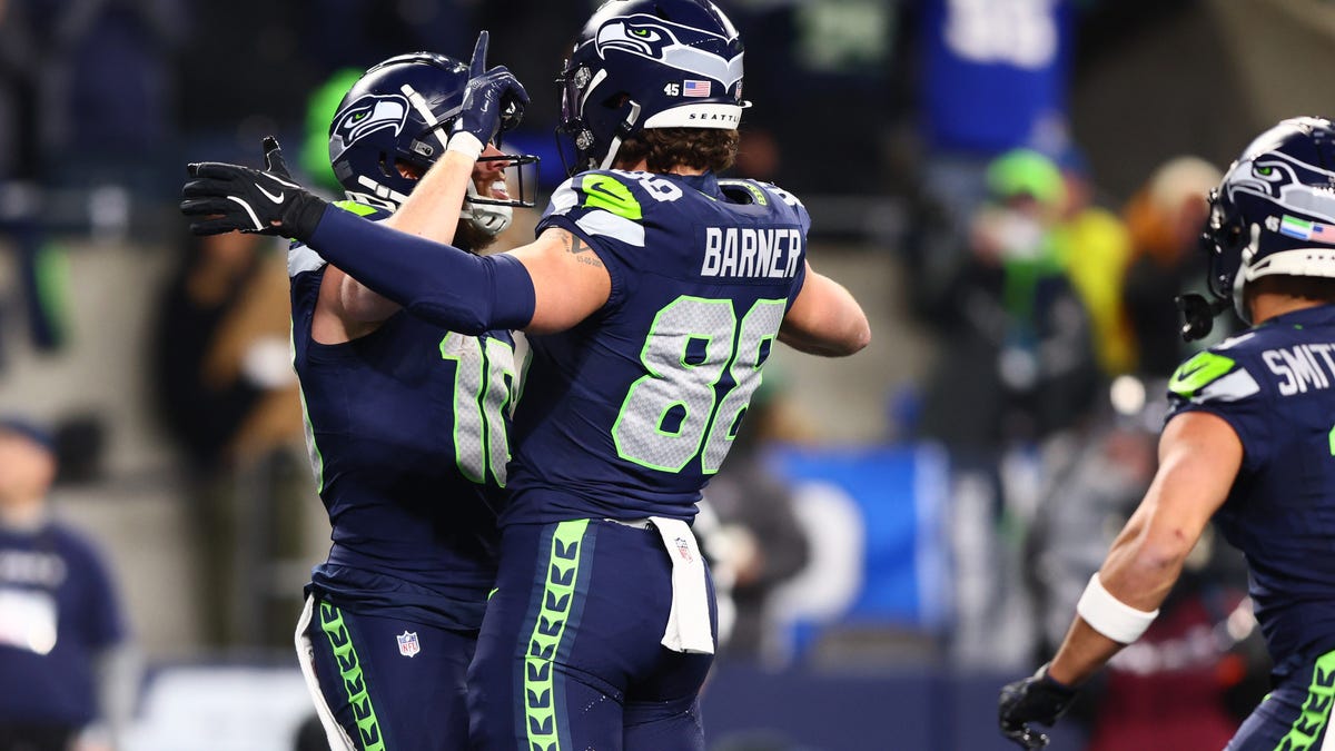 Jan 25, 2026; Seattle, WA, USA; Seattle Seahawks wide receiver Cooper Kupp (10) celebrates with tight end AJ Barner (88) after scoring a touchdown against the Los Angeles Rams during the second half in the 2026 NFC Championship Game at Lumen Field. Mandatory Credit: Kevin Ng-Imagn Images