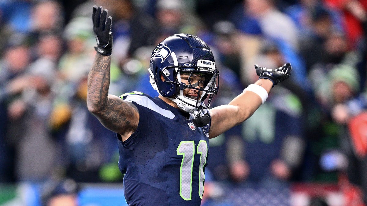 Jaxon Smith-Njigba #11 of the Seattle Seahawks celebrates after scoring a second quarter touchdown against the Los Angeles Rams in the NFC Championship game at Lumen Field on January 25, 2026 in Seattle, Washington.