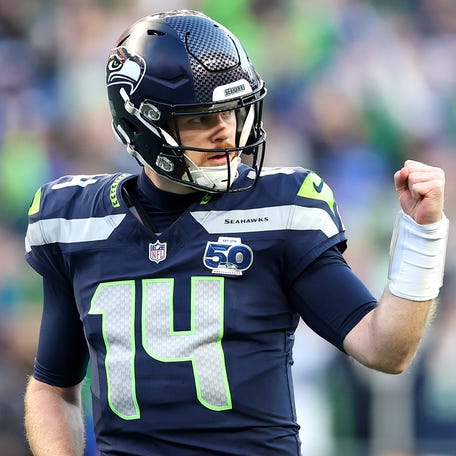 SEATTLE, WASHINGTON - JANUARY 25: Sam Darnold #14 of the Seattle Seahawks celebrates a first quarter touchdown against the Los Angeles Rams in the NFC Championship game at Lumen Field on January 25, 2026 in Seattle, Washington. (Photo by Steph Chambers/Getty Images)