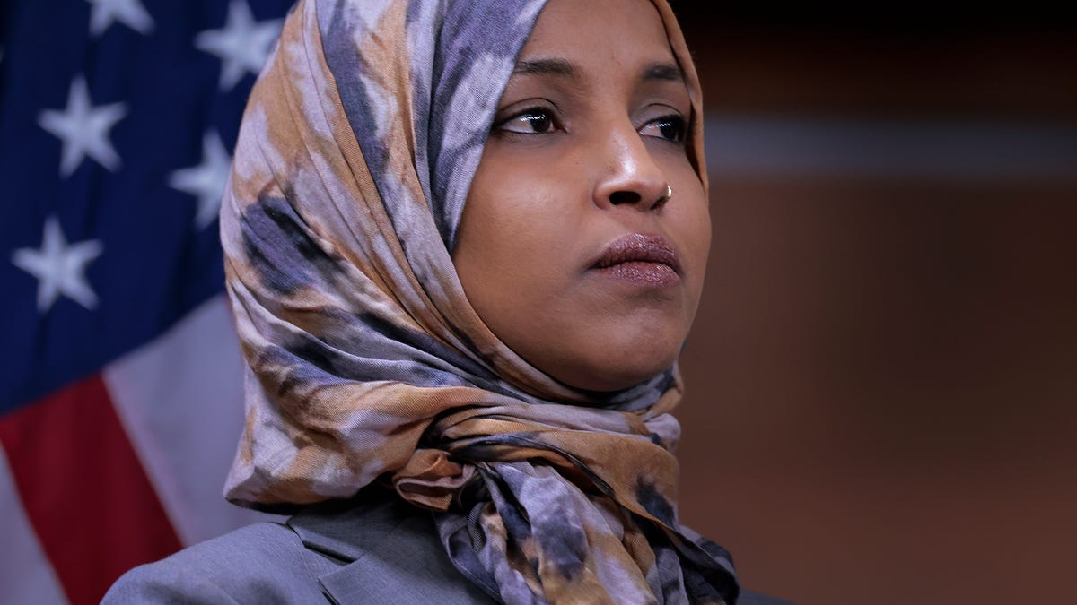 Rep. Ilhan Omar (D-MN), Deputy Chair of the Congressional Progressive Caucus, listens to other members of the CPC at a press conference at the U.S. Capitol on January 13, 2026 in Washington, DC.
