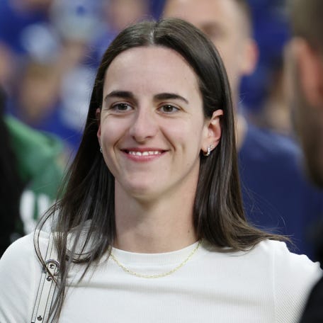 Oct 5, 2025; Indianapolis, Indiana, USA; Caitlin Clark looks on from the sideline during warmups before the game between the Las Vegas Raiders and the Indianapolis Colts at Lucas Oil Stadium. Mandatory Credit: Trevor Ruszkowski-Imagn Images