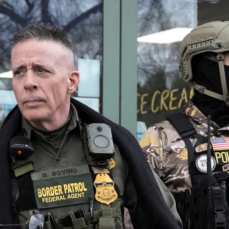 Border Patrol commander Greg Bovino looks on as he and his convoy stop at a gas station, days after an ICE agent fatally shot Renee Nicole Good in Minneapolis, in Columbia Heights, Minnesota, U.S., January 13, 2026.