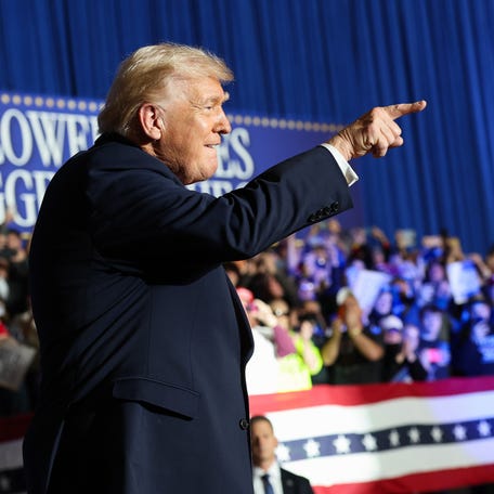 President Donald Trump takes the stage at a rally on Jan. 27, 2026, in Clive, Iowa.