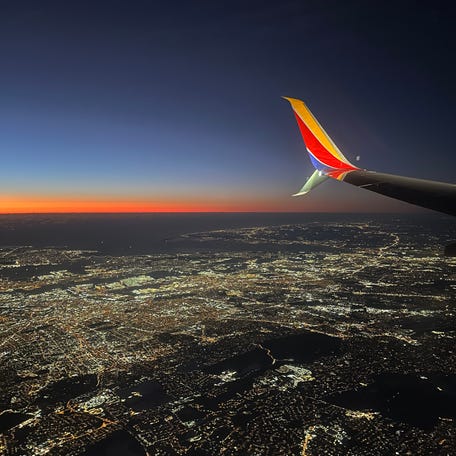 Sunrise seen from one of the first Southwest Airlines flights with assigned seats.