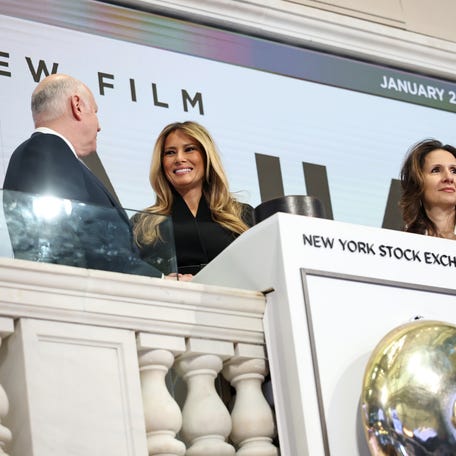(L-R) Jeffrey Sprecher, Melania Trump and Lynn Martin are seen as first lady Melania Trump rings the NYSE opening bell to celebrate the upcoming film "Melania" at New York Stock Exchange on January 28, 2026 in New York City.