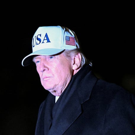 President Donald Trump walks upon arrival on the South Lawn of the White House in Washington, U.S., January 27, 2026.