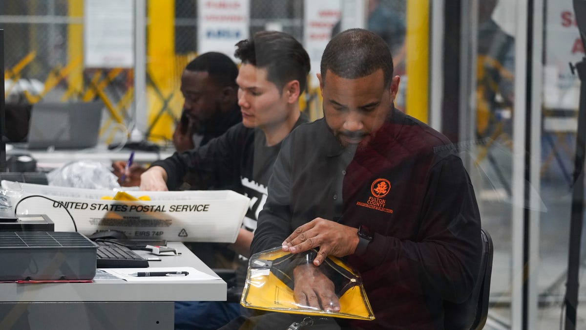 Ballots are tabulated on election night at the Fulton County Elections Hub and Operation Center on November 5, 2024 in Fairburn, Georgia. Americans cast their ballots today in the presidential race between Republican nominee former President Donald Trump and Democratic nominee Vice President Kamala Harris, as well as multiple state elections that will determine the balance of power in Congress.
