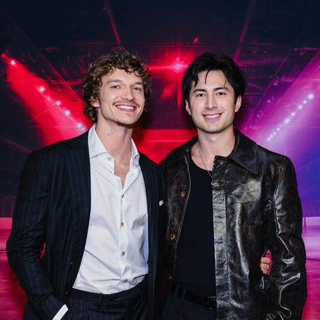 Connor Storrie, left, and Hudson Williams attend the premiere of "Heated Rivalry" at TIFF Lightbox on Nov. 24, 2025 in Toronto, Ontario.