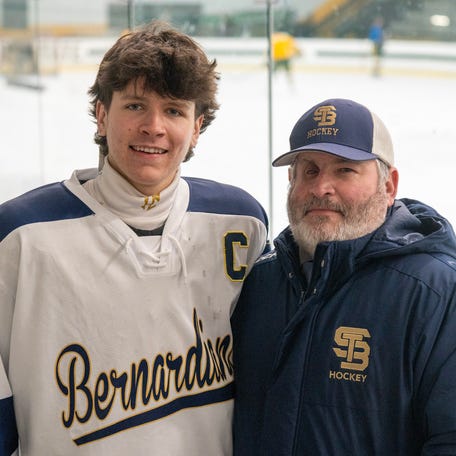 St. Bernard’s head coach Stephen Sylvia and his son Matthew Sylvia Jan. 28 at the Wallace Civic Center in Fitchburg.