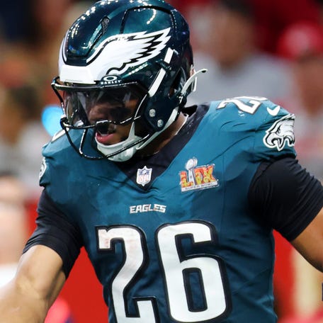 NEW ORLEANS, LOUISIANA - FEBRUARY 09: Saquon Barkley #26 and A.J. Brown #11 of the Philadelphia Eagles celebrate after Brown caught a pass for a touchdown in the second quarter against the Kansas City Chiefs during Super Bowl LIX at Caesars Superdome on February 09, 2025 in New Orleans, Louisiana. (Photo by Gregory Shamus/Getty Images)