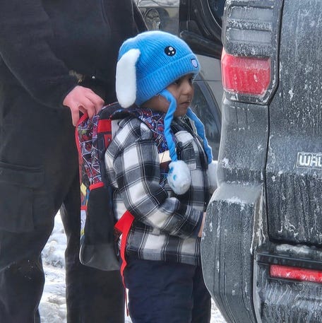 An ICE agent holds onto the backpack of a 5-year-old student at Valley View Elementary, Liam Conejo Ramos, as he is being detained on Jan 20, 2026, in Minneapolis, Minn. in this photo obtained on Jan. 23, 2026, courtesy of Columbia Heights Public Schools.