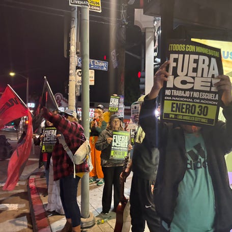 People gather to protest federal immigration enforcement on an intersection in Boyle Heights in Los Angeles on Wednesday, Jan. 28, 2026.