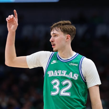 Dallas Mavericks forward Cooper Flagg (32) reacts during the second half against the Charlotte Hornets at American Airlines Center.